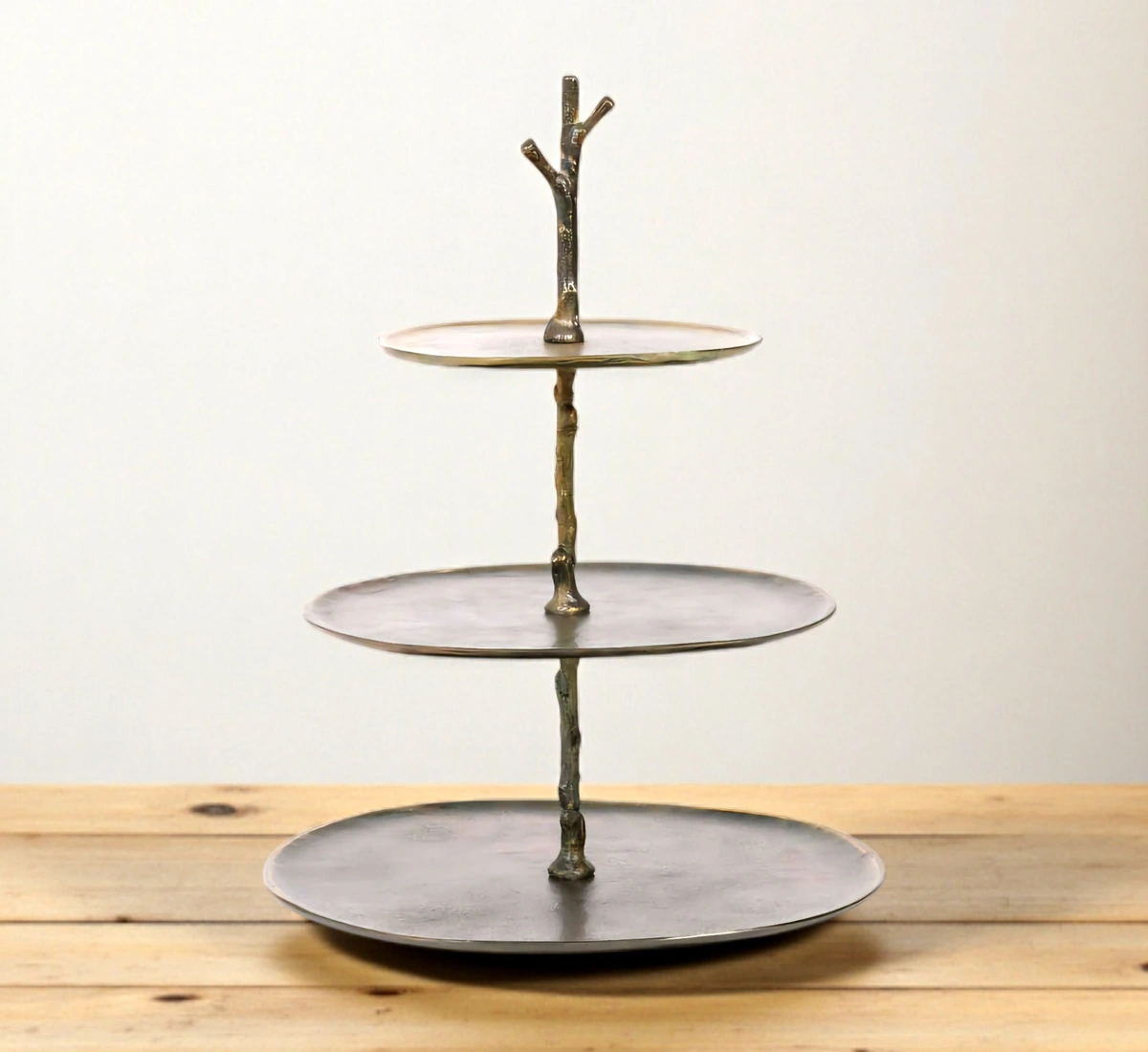 Rustic antique bronze 3-tier cake stand with branch design.