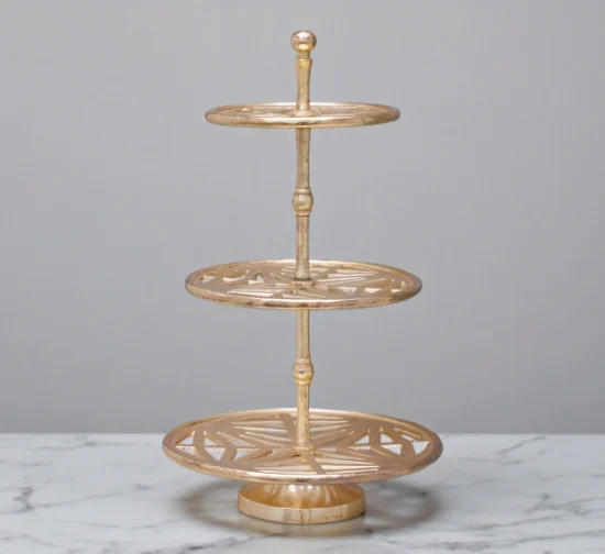 Modern gold 3-tier serving stand with geometric cutout pattern trays.