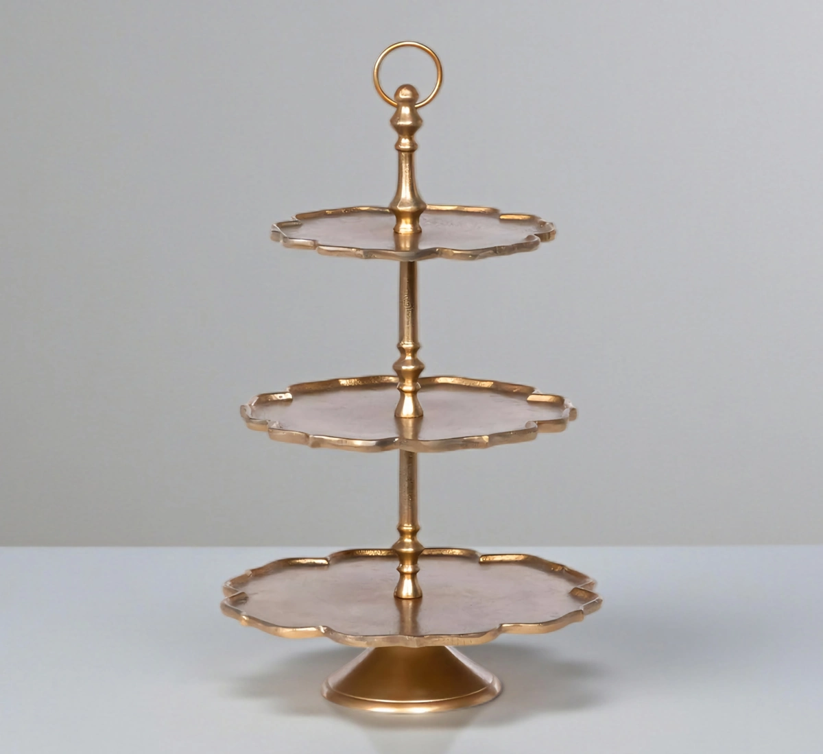 Vintage gold 3-tier serving stand with scalloped flower-shaped trays.
