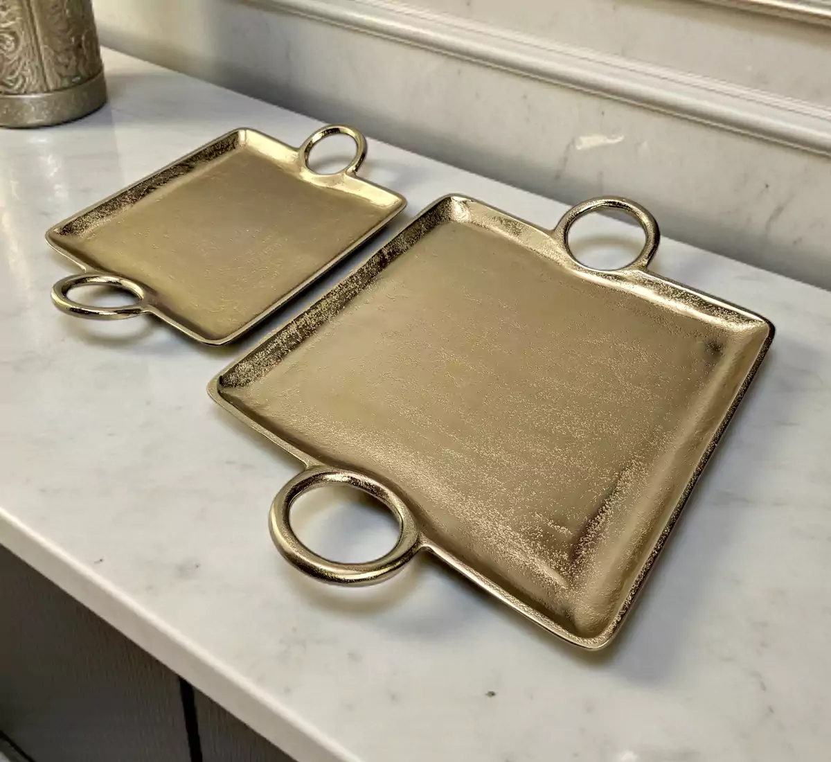 Set of 2 square gold metal serving trays with textured finish and handles