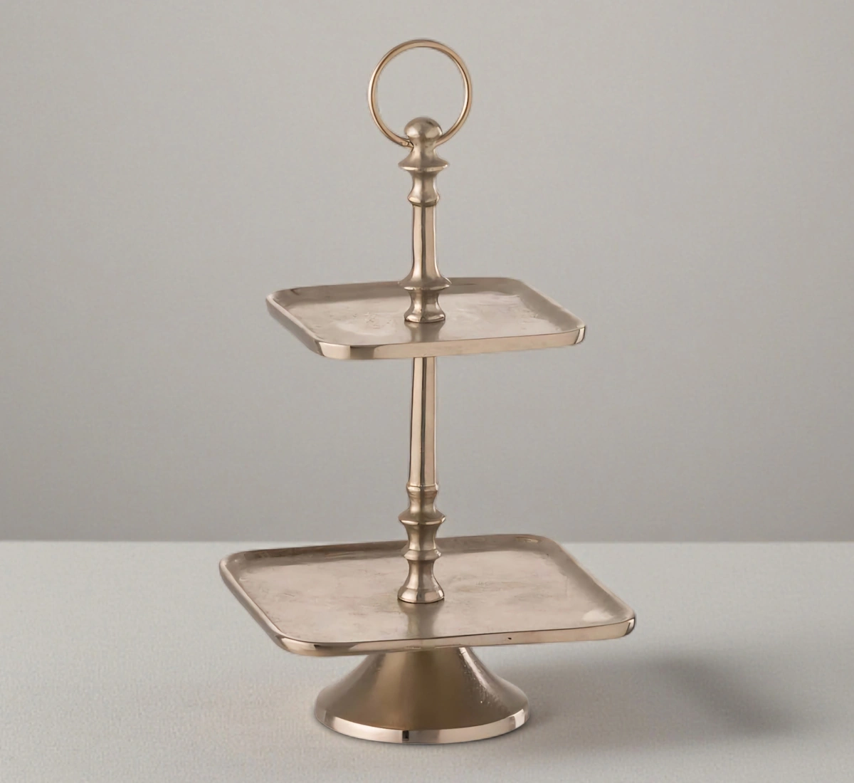 Modern champagne gold 2-tier square serving stand.