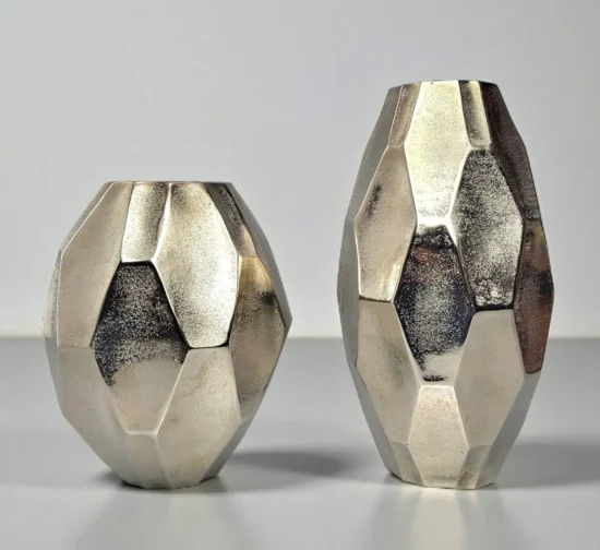 Set of two modern silver metal vases with diamond faceted design.